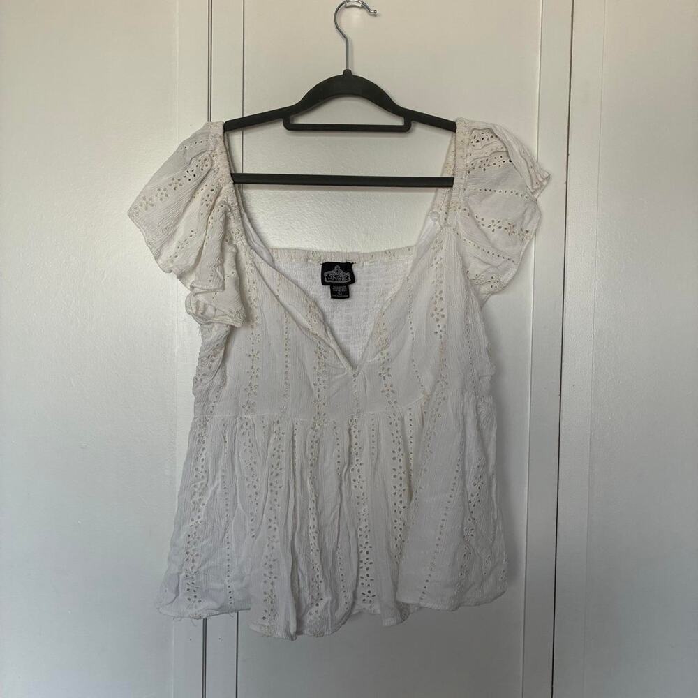 White eyelet lace blouse with